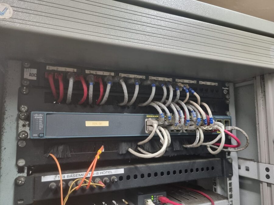 Network switch and dressed cabling in a comms rack