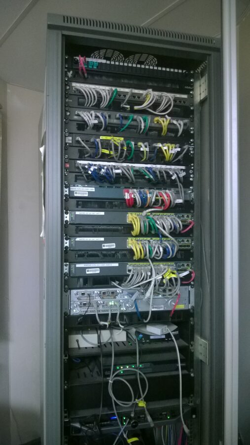 Full-height comms rack cabled and labelled to standard