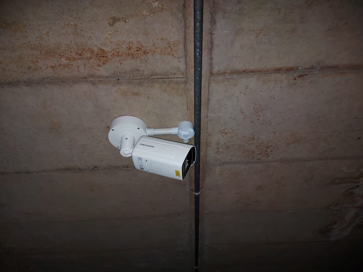 Wall-mounted IP surveillance camera installed by Fibretech