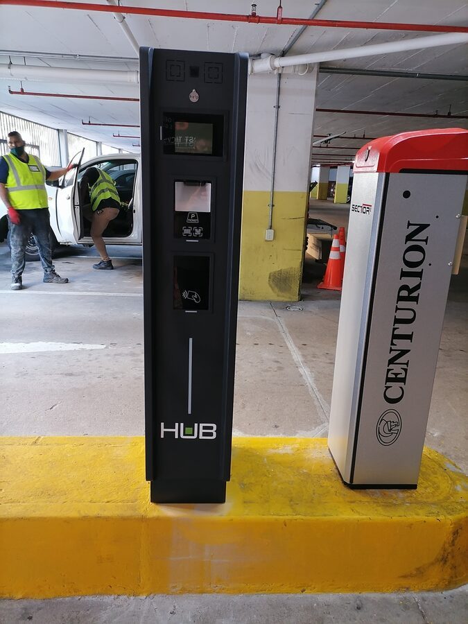 Pay-on-foot parking station with marked pedestrian line